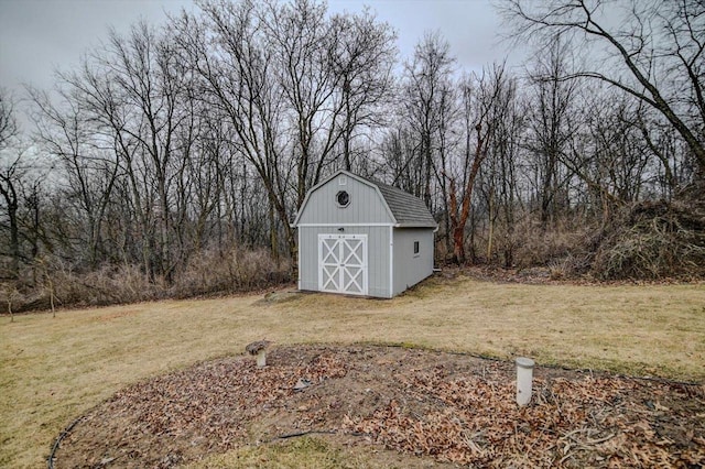 view of outbuilding featuring a yard