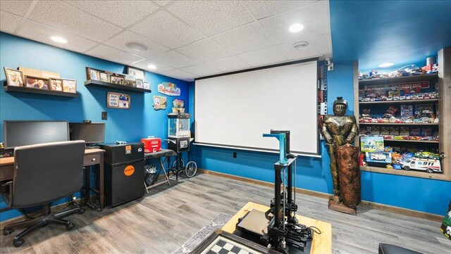 office space featuring hardwood / wood-style flooring and a drop ceiling