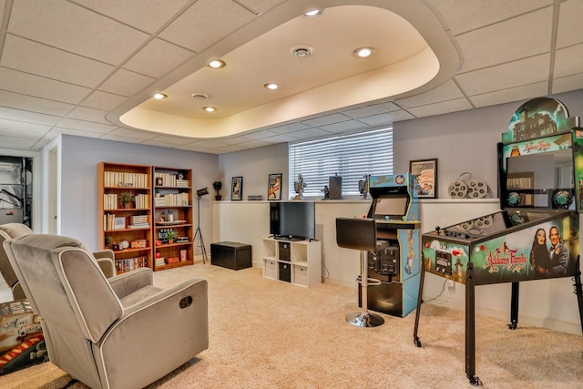 interior space with carpet flooring and a drop ceiling