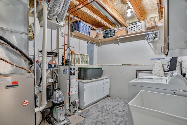 utilities featuring sink, washing machine and dryer, and water heater