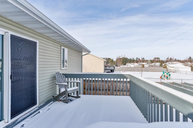 view of snow covered deck