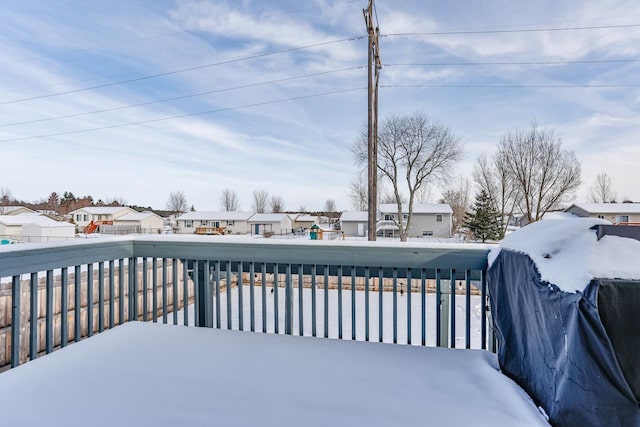 snow covered deck with grilling area