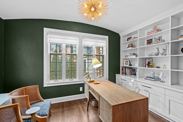 office space with lofted ceiling, dark hardwood / wood-style floors, a chandelier, and built in shelves