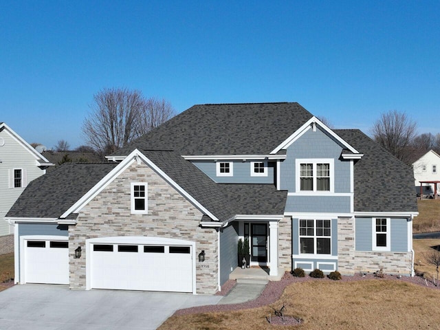 view of front facade featuring a front yard and a garage