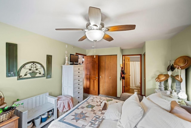 bedroom with ceiling fan and a closet