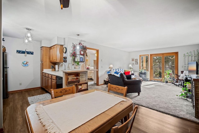 dining room featuring sink and dark hardwood / wood-style floors