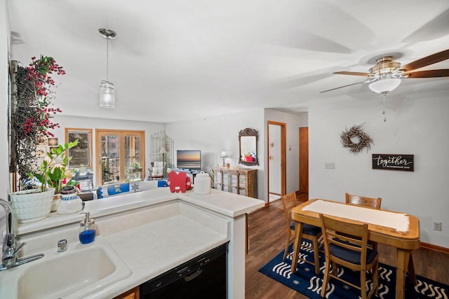 kitchen with ceiling fan, dark hardwood / wood-style flooring, dishwasher, and sink