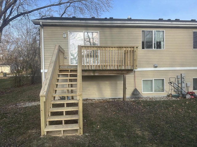 back of house with a wooden deck