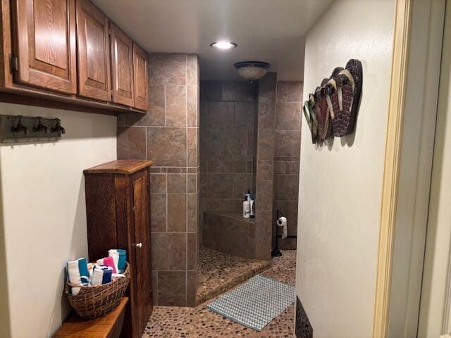 bathroom with a tile shower