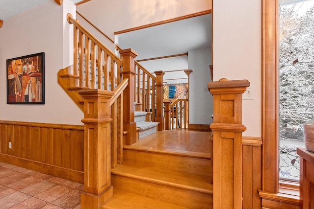 2532 Huntington Way, Suamico, WI 54173 - stairway with wainscoting, wood walls, and a wealth of natural light
