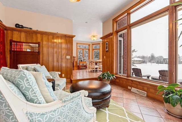 2532 Huntington Way, Suamico, WI 54173 - sitting room with tile patterned floors, wooden walls, and visible vents