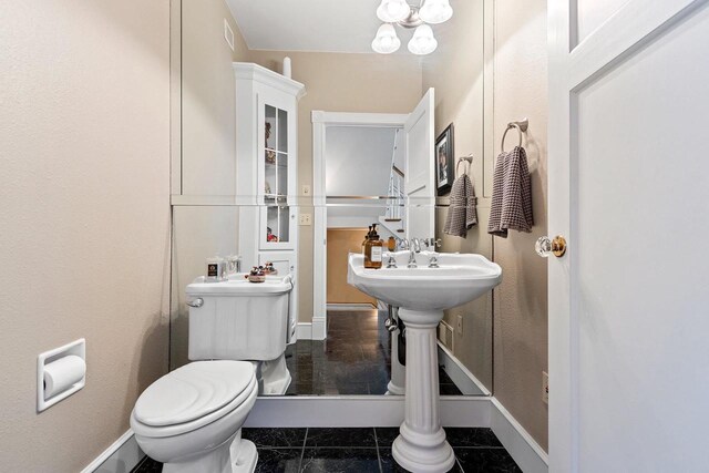 2532 Huntington Way, Suamico, WI 54173 - half bathroom featuring visible vents, baseboards, marble finish floor, and toilet