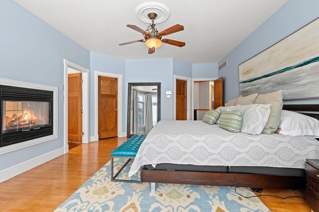 2532 Huntington Way, Suamico, WI 54173 - bedroom with wood finished floors, visible vents, and baseboards