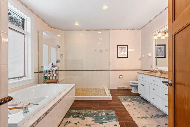 2532 Huntington Way, Suamico, WI 54173 - bathroom with wood finished floors, visible vents, a walk in shower, and a healthy amount of sunlight