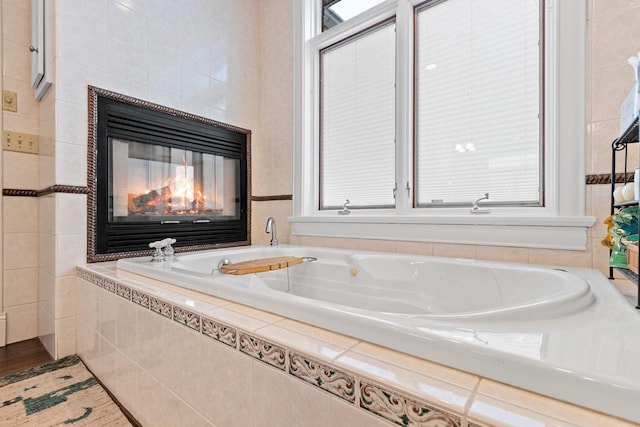 2532 Huntington Way, Suamico, WI 54173 - full bathroom featuring a tub with jets and a fireplace
