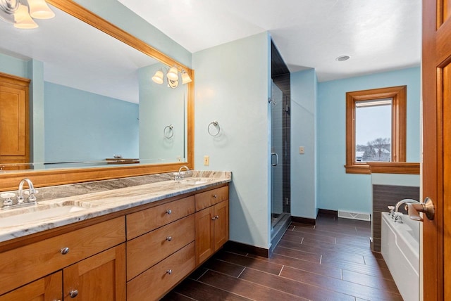 2532 Huntington Way, Suamico, WI 54173 - full bath featuring a shower stall, double vanity, wood finished floors, a sink, and baseboards