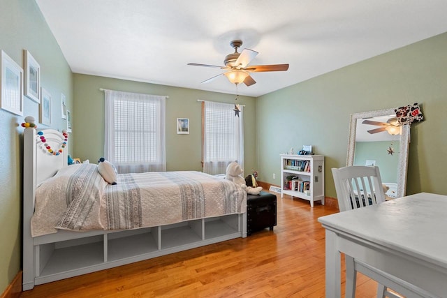 2532 Huntington Way, Suamico, WI 54173 - bedroom with baseboards, wood finished floors, and ceiling fan