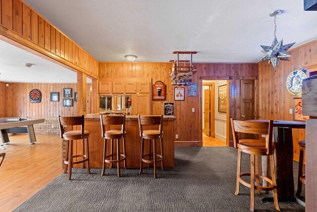 2532 Huntington Way, Suamico, WI 54173 - bar with indoor bar, wood finished floors, and wood walls