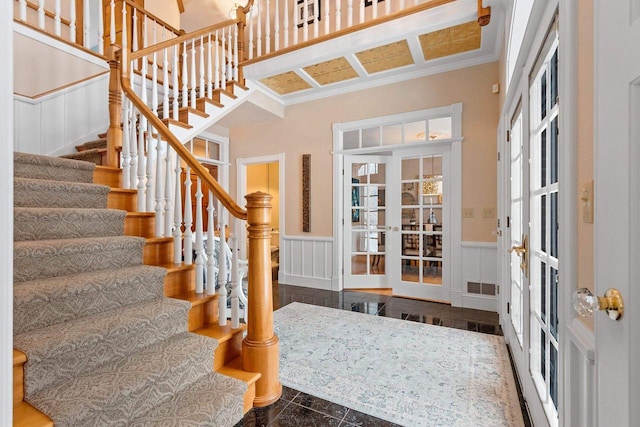 2532 Huntington Way, Suamico, WI 54173 - foyer entrance with a wainscoted wall, visible vents, ornamental molding, a decorative wall, and stairs