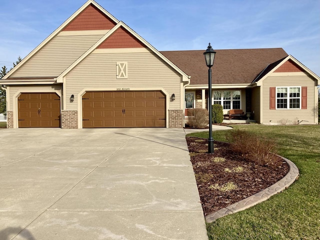 view of front of house with a garage and a front yard