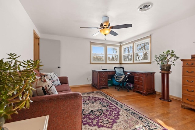 office space featuring ceiling fan and light wood-type flooring