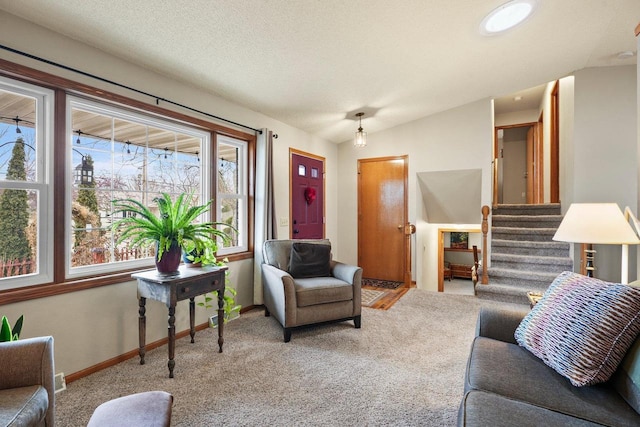 living room with lofted ceiling, light colored carpet, and a textured ceiling