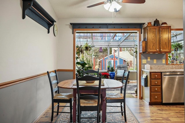 dining area featuring light hardwood / wood-style flooring and ceiling fan