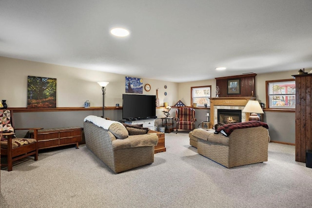 carpeted living room with a healthy amount of sunlight