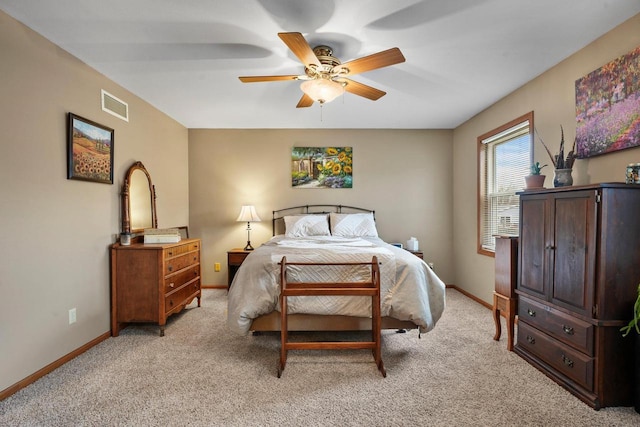 bedroom featuring ceiling fan and light carpet