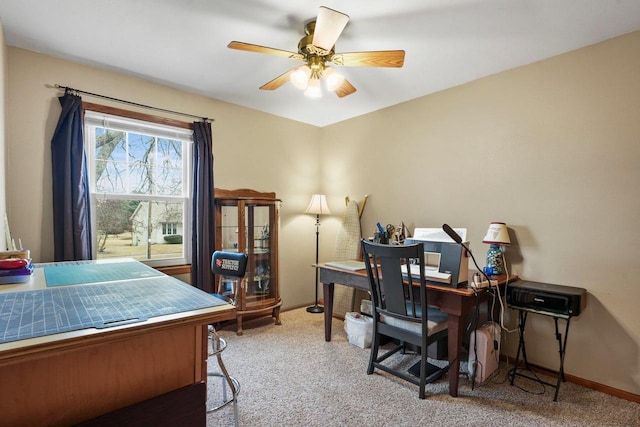 office space featuring light colored carpet and ceiling fan