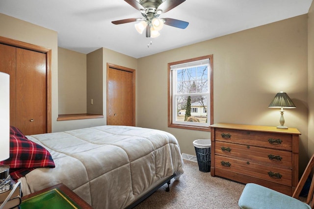 carpeted bedroom with ceiling fan