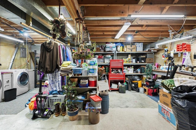 basement with separate washer and dryer and electric panel