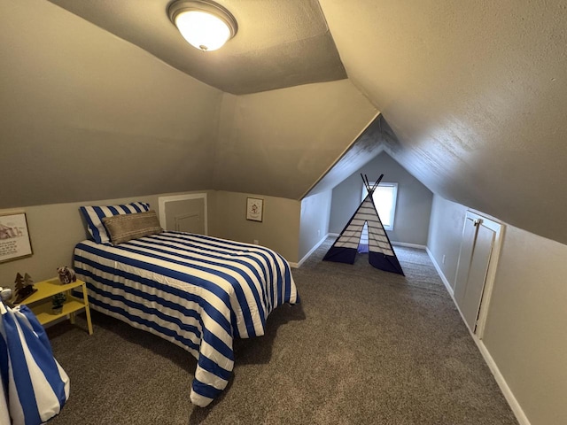 bedroom featuring carpet floors, a textured ceiling, and vaulted ceiling