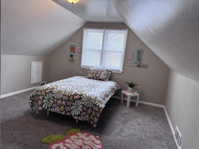 carpeted bedroom with vaulted ceiling