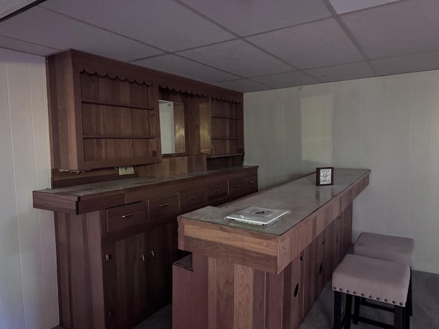 bar featuring a paneled ceiling