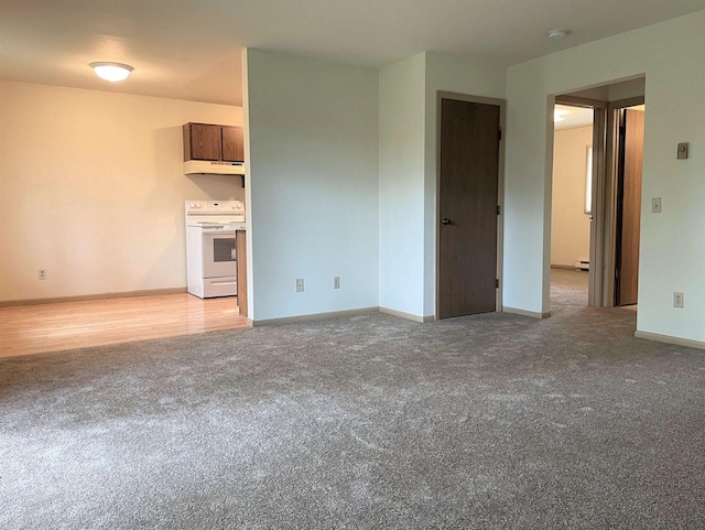 unfurnished living room with light colored carpet