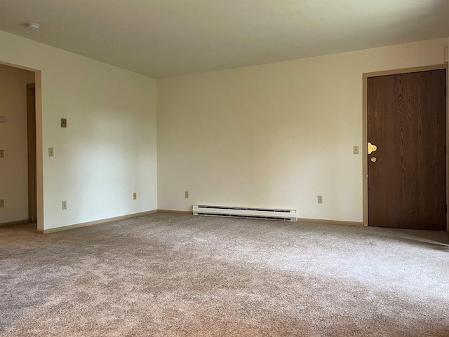 carpeted empty room with a baseboard radiator