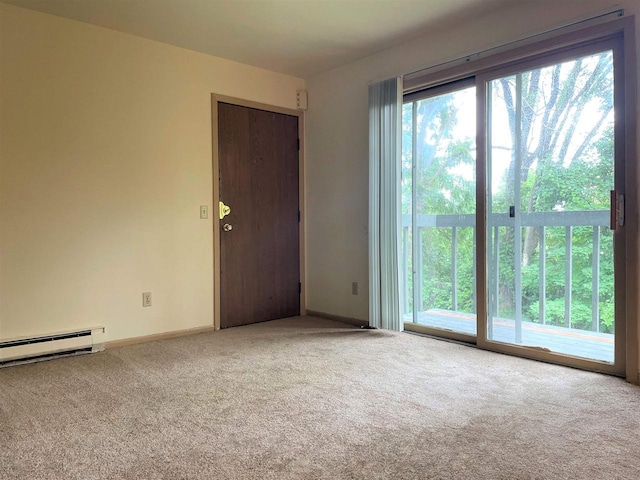 carpeted empty room with baseboard heating