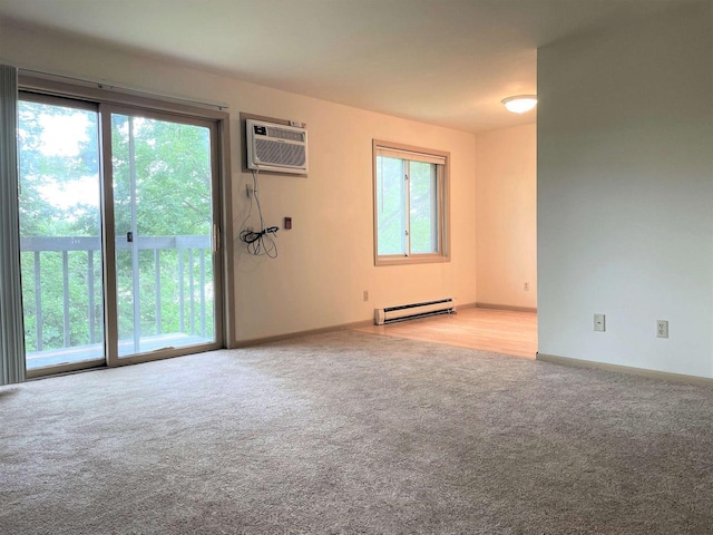 unfurnished room with a baseboard radiator, light carpet, plenty of natural light, and a wall mounted AC