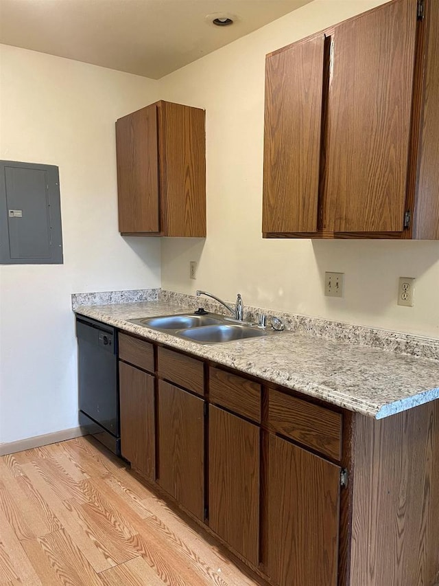 kitchen with electric panel, black dishwasher, sink, and light hardwood / wood-style flooring