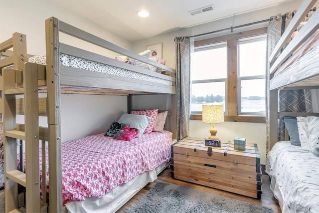 bedroom with hardwood / wood-style flooring