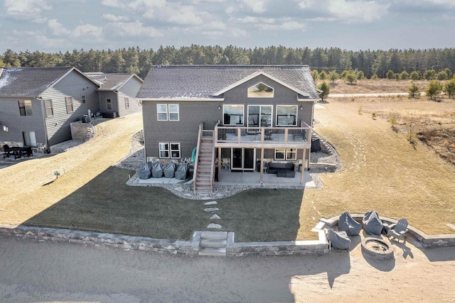 view of front of property with a wooden deck and a patio area