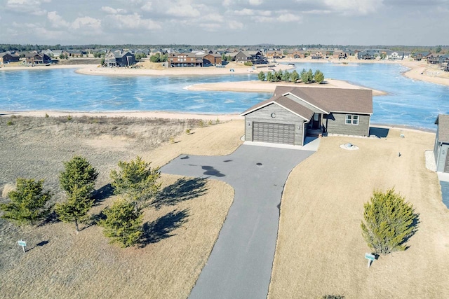 drone / aerial view with a view of the beach and a water view