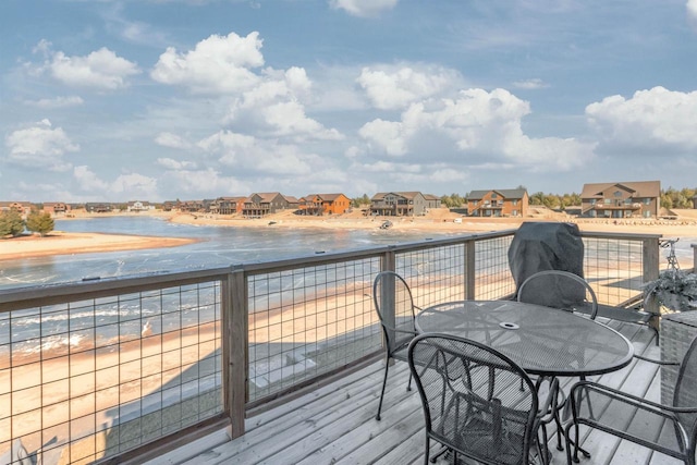 wooden terrace with a water view