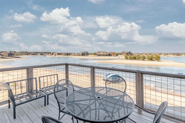 wooden terrace with a water view