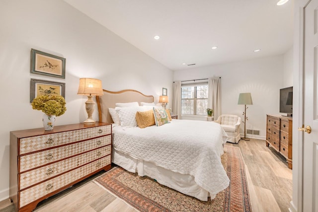 bedroom with light hardwood / wood-style floors