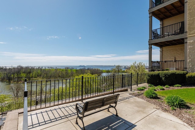 view of patio with a water view