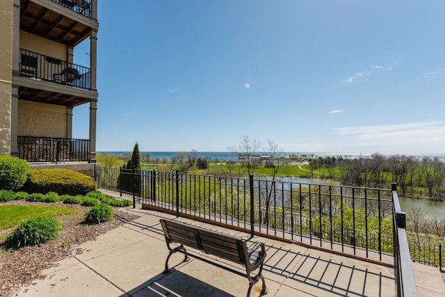 view of patio featuring a water view