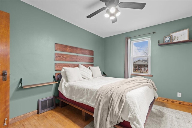 bedroom featuring light hardwood / wood-style floors and ceiling fan