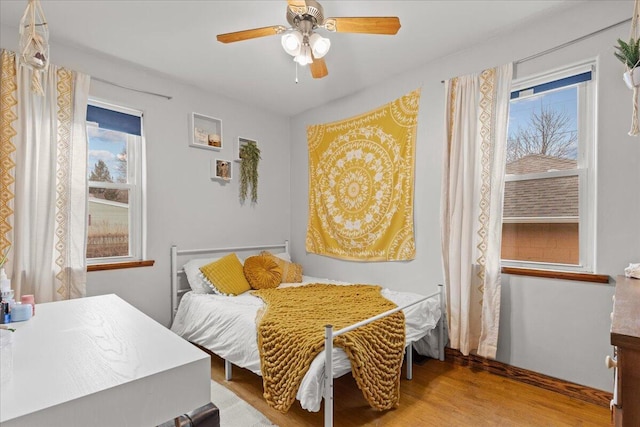 bedroom featuring ceiling fan and light wood-type flooring